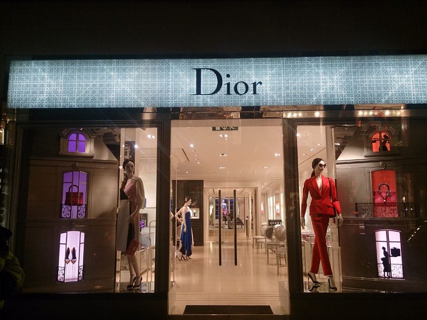 Full shot of Dior Christmas shop window display at night